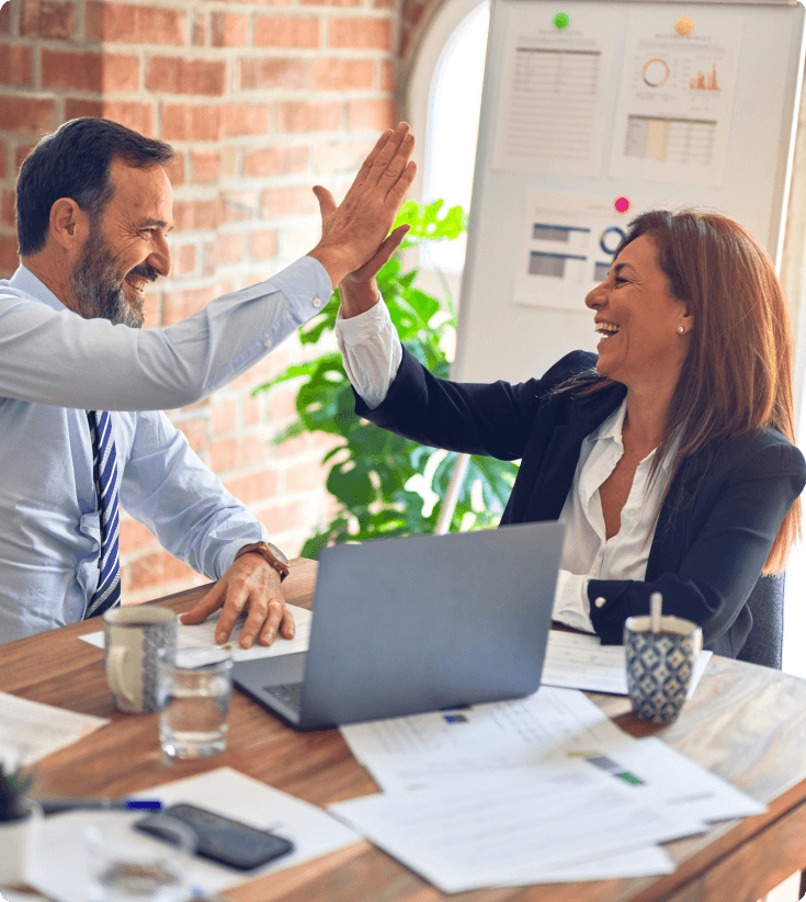 An image depicting a man and a woman joyfully high-fiving, representing a positive interaction - 42company.